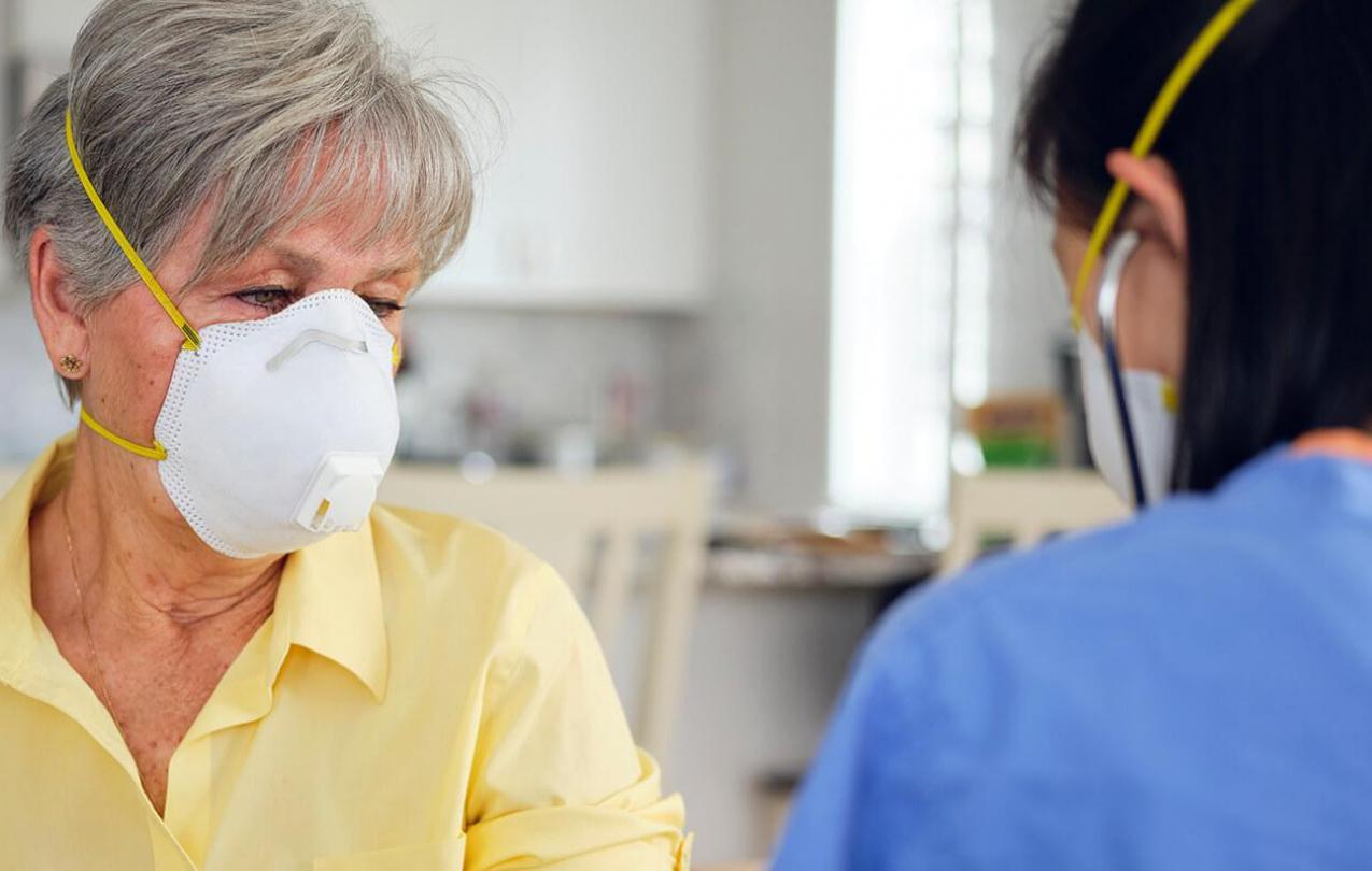 Elderly woman in face mask